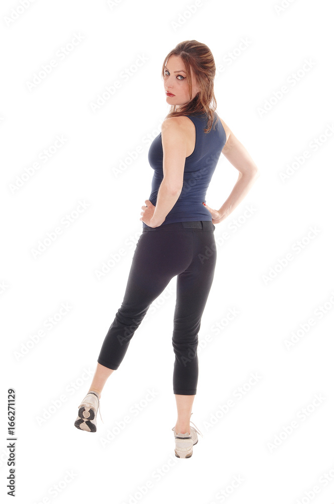 Woman standing in exercising outfit from back Woman standing in exercising outfit from back
