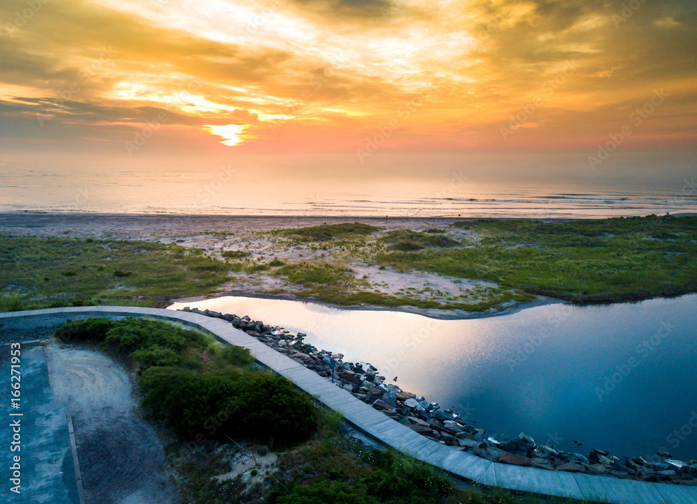 Fototapeta premium Sunset over the ocean in Wildwood, New Jersey aerial