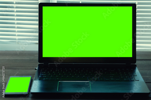 laptop and smart phone with green screen