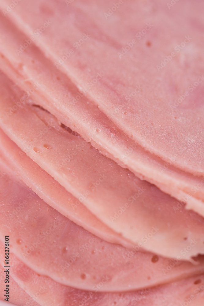 Closeup macro sliced ham delicious meat on the plate Closeup macro sliced ham delicious meat on the plate