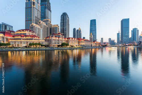 Tianjin city waterfront downtown skyline with Haihe river China.
