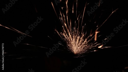 Sparks fly out of the darkness. Screensaver or element for special effects. Black color instead of green background.