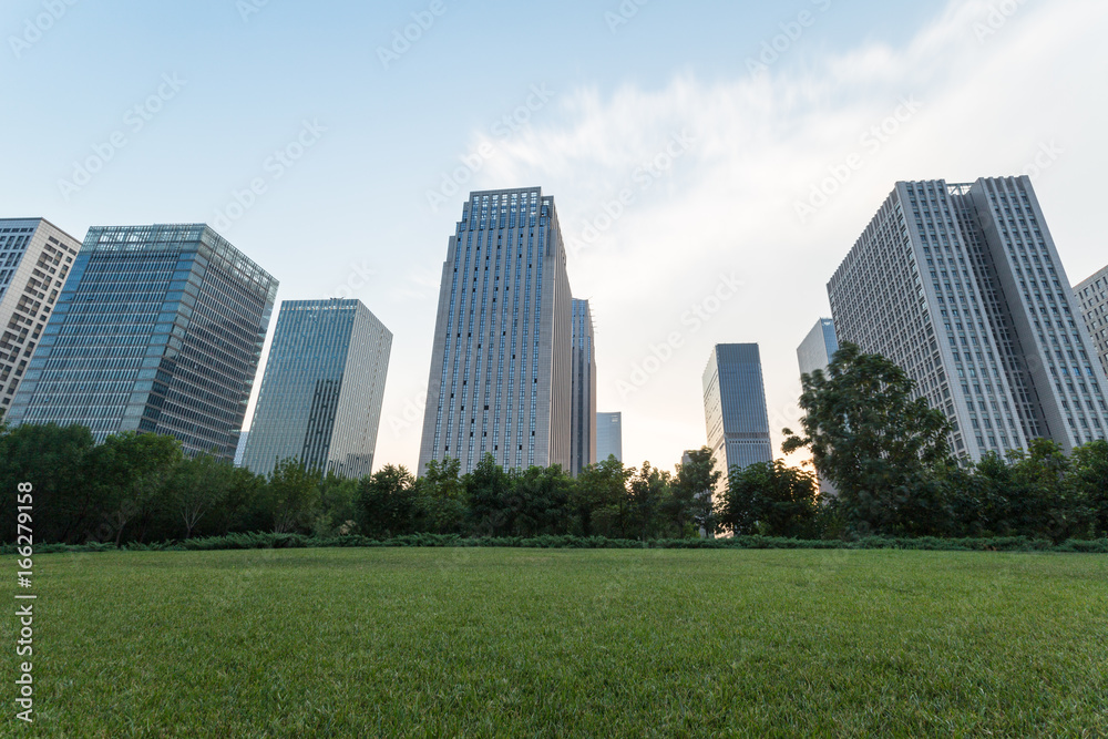 city downtown district with green lawn,dalian city,china.