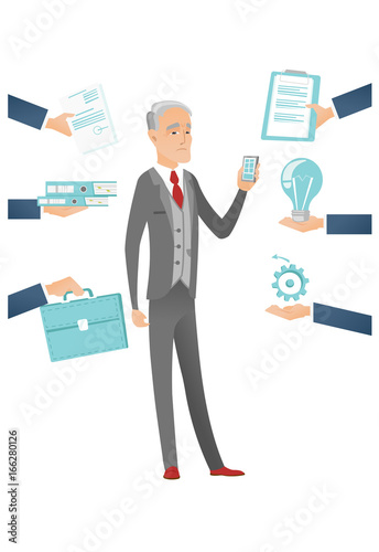 Caucasian businessman having lots of work to do.