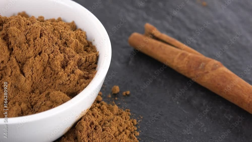 Portion of Cinnamon rotating on a wooden plate (not loopale; 4K) Portion of Cinnamon rotating on a wooden plate (not loopale; 4K)