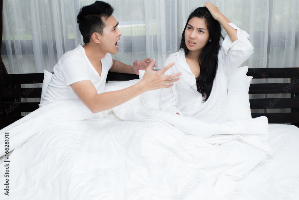 Unhappy couple having problems at bedroom Unhappy couple having problems at bedroom