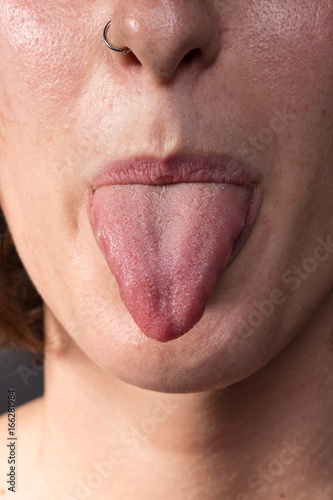 Woman showing tongue out of mouth