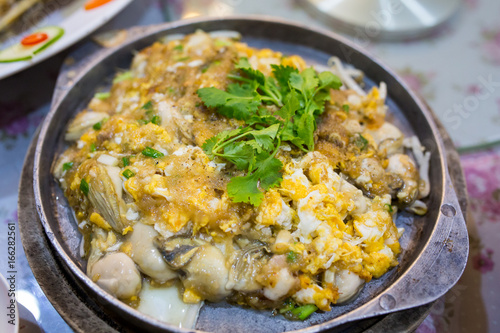 Chinese Oyster Omelette on the hot pan, Chinese Food in Thailand.