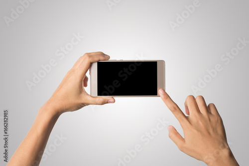 Woman Hand holding smart phone blank screen. Copy space. Hand holding smartphone isolated on white background.