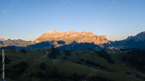 Great landscape on the Dolomites. Drone aerial view on Sella group and Bo peaks during the summer sunrise. Alta Badia, Sud Tirol, Italy © Matteo Ceruti