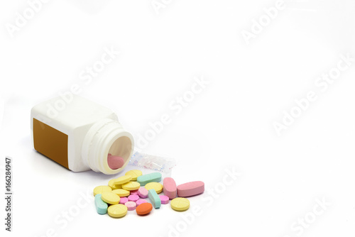 multicolor medical tablets  on white background photo