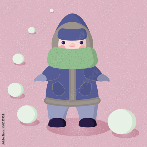 A small child dressed a warm hooded snow suit and a big scarf on a snowfall and snowballs background