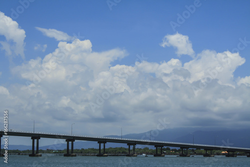 The Bridge across the sea and blue sky in Thailand © Kasem