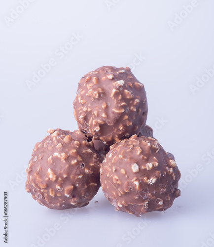 chocolate ball or chocolate bonbon on a background.