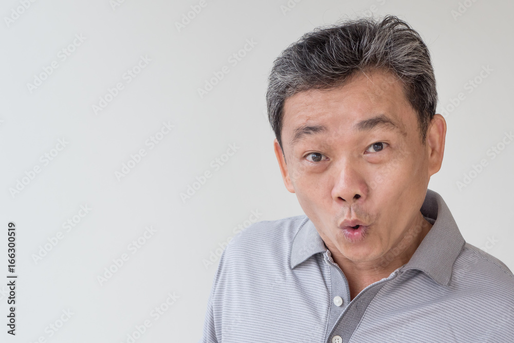 exited, confident, happy old senior or middle age asian man face looking at camera exited, confident, happy old senior or middle age asian man face looking at camera