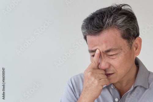 sick old senior man headache, dizzyness, sinus inflammation, migraine