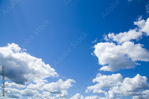 Blue sky with clouds in sunny day. Background.