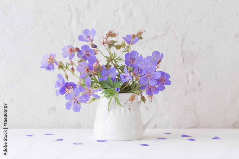 flowers in jug on white background flowers in jug on white background