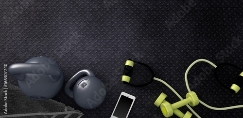 3D rendering of Fitness background with kettlebells and smartphone.