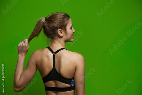 Back view of young fitness woman