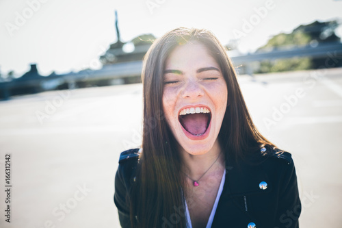 Brunette having fun outdoors at sunset