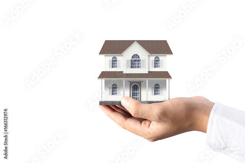 Mortgage concept by house from hand