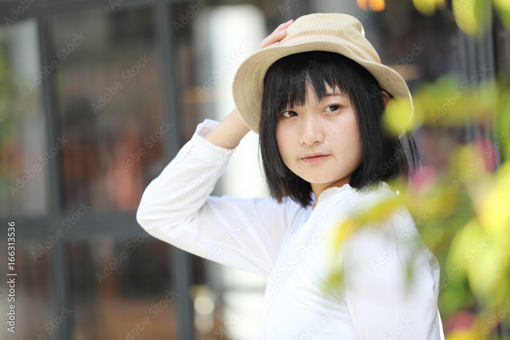 Asian young woman thinking and looking portrait with in coffee shop Asian young woman thinking and looking portrait with in coffee shop