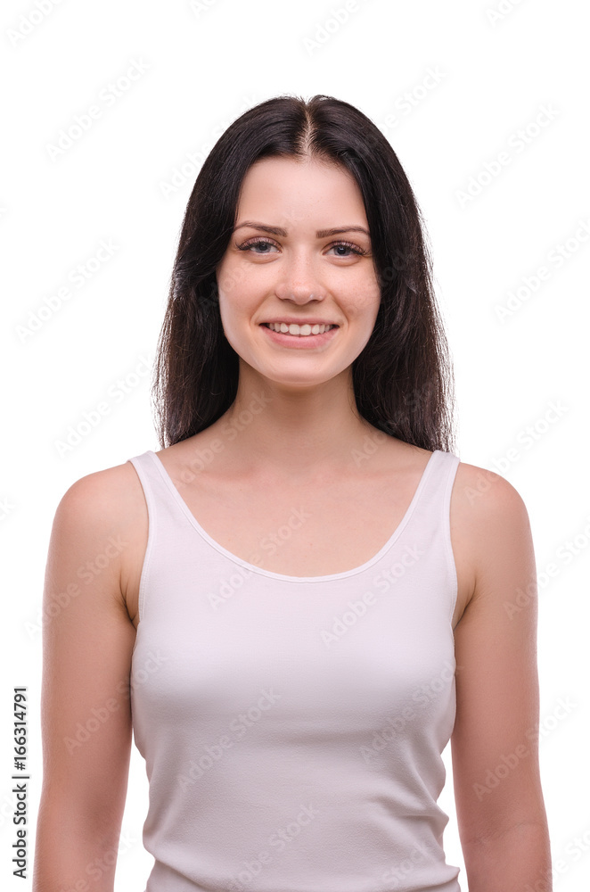 Young attractive girl smiling on a white background. Portrait. Beautiful woman.