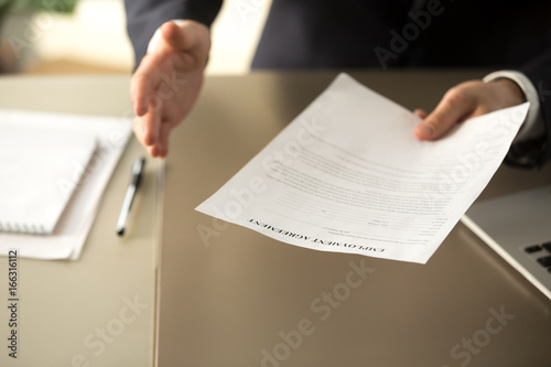 Foto Close up view of employer offering work, businessman extending agreement for sig