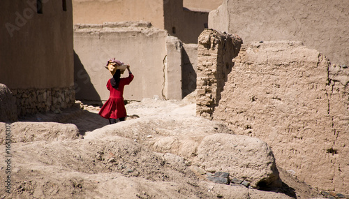 Girl carrying bread in the suburbs of Kabul, Afghanistan