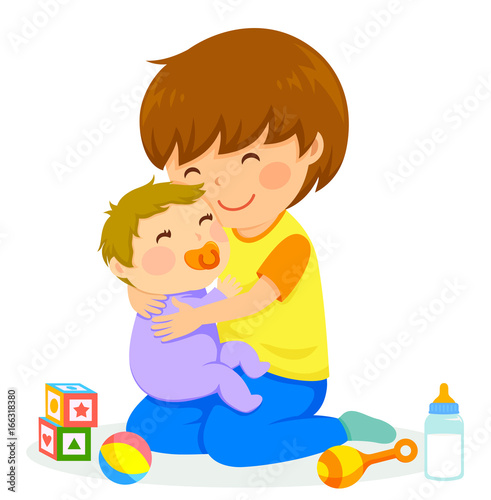 little boy hugging a baby