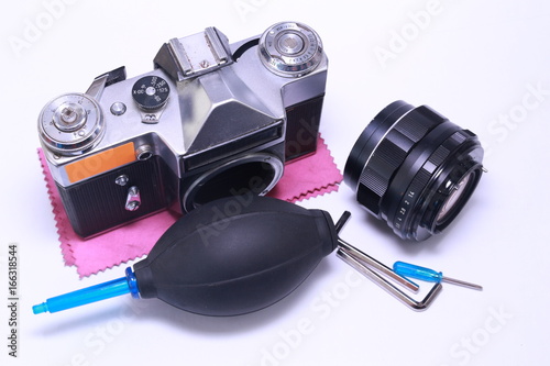 Tools for repairing camera, remove dust. camera cleaning services conceptual image