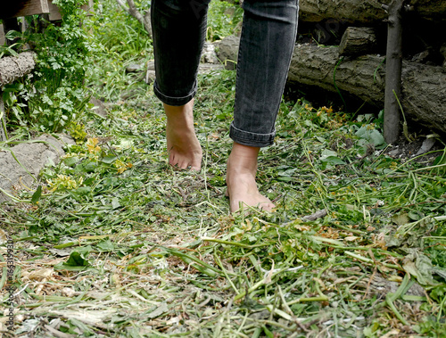 Girl walking barefoot in the garden