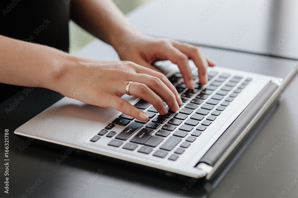 Hands of a beautiful girl on laptop, notebook Hands of a beautiful girl on laptop, notebook