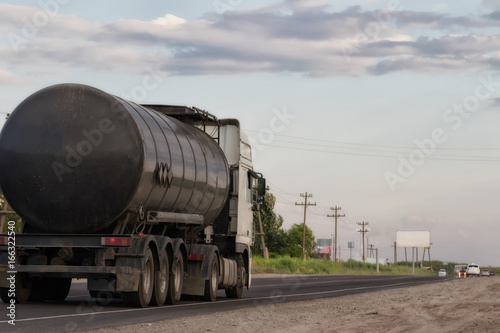 truck with fuel tanker at road