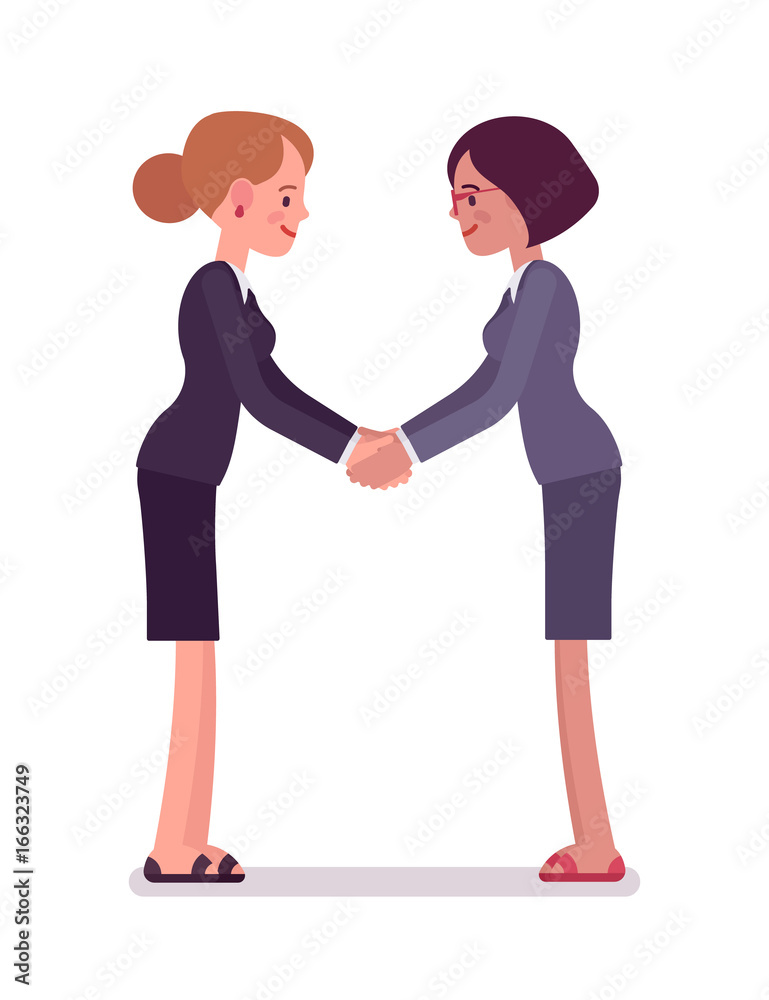 Business female partners handshaking with both hands Business female partners handshaking with both hands