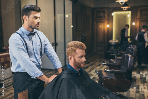 barber with customer in barber shop