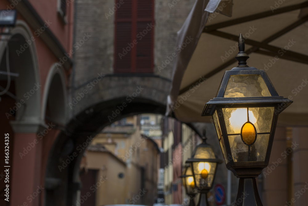 Small street italian lanterns near the old arch
