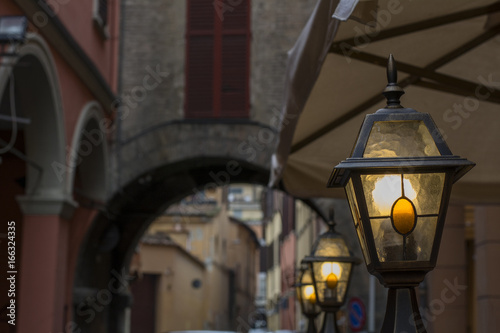 Small street italian lanterns near the old arch