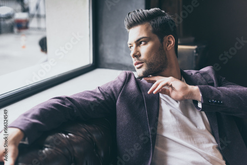 handsome man with fashionable hairstyle photo