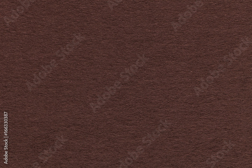 Texture of old brown paper closeup. Structure of a dense cardboard. The background.