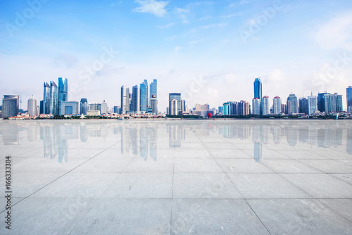 Panoramic skyline and buildings with empty concrete square floor