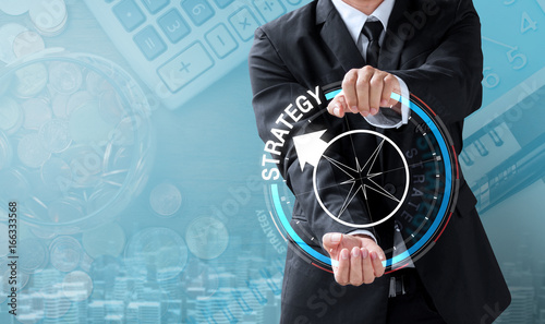 business man drive compass to strategy
