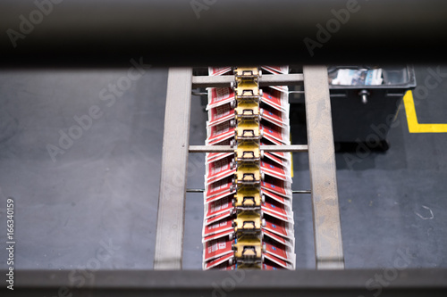 Freshly printed papers on conveyer belt 3