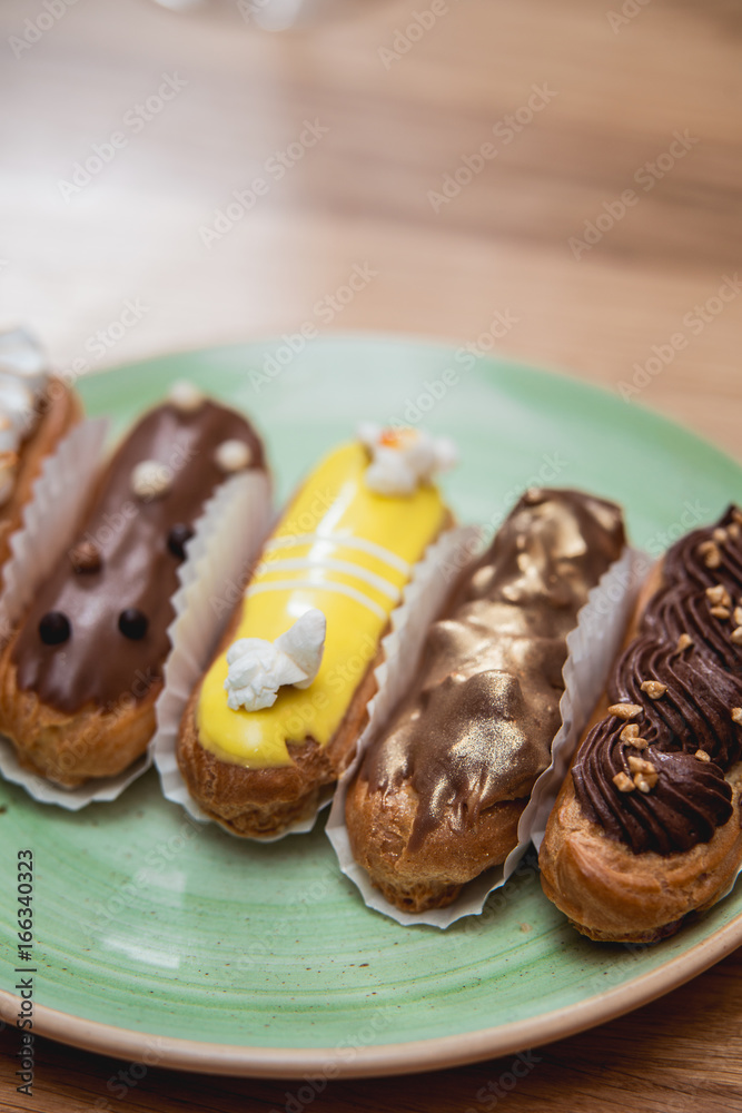 Eclairs with different ganache and icing with different toppings