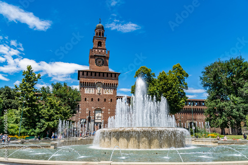 Main entrance to the Sforza Castle - Castello Sforzesco and fountain in front of it, Milan, Italy