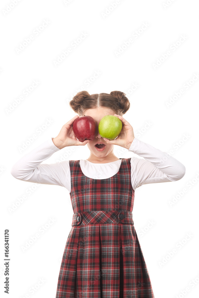 Portrait of cute girl in school uniform posing with apple against white background Portrait of cute girl in school uniform posing with apple against white background