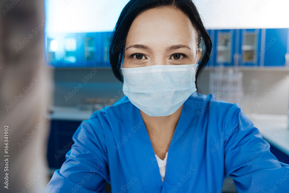 Professional female doctor wearing a mask