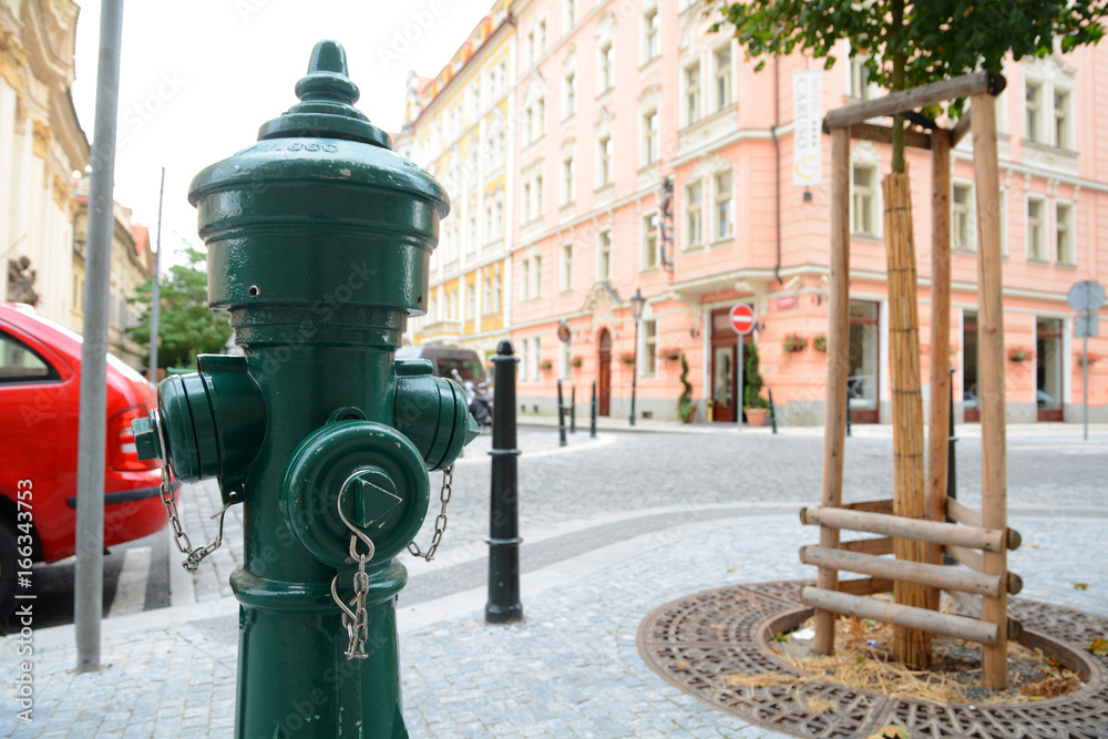Fire hydrant in the middle of the street. Faucet in the of the stree. Fire hydrant in the middle of the street. Faucet in the of the stree.