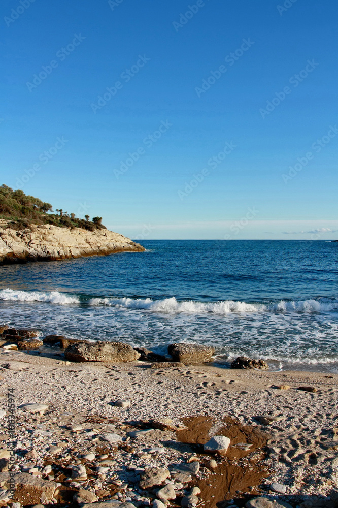 Lonely sea beach with white waves Lonely sea beach with white waves